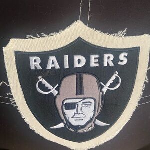Raiders logo throw pillow